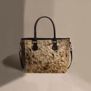 Spacious Large Cowhide Tote Bag with fringe! A Western Cowhide Purse perfect as a Cowhide Tote Shoulder Bag. Genuine Cowhide Leather Purse Bag, an ideal gift.