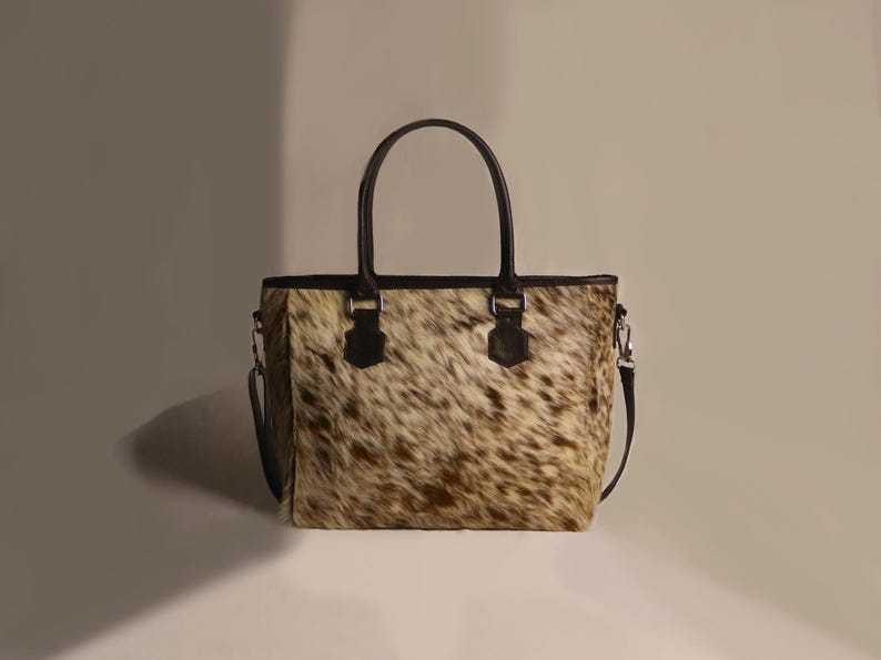Spacious Large Cowhide Tote Bag with fringe! A Western Cowhide Purse perfect as a Cowhide Tote Shoulder Bag. Genuine Cowhide Leather Purse Bag, an ideal gift.