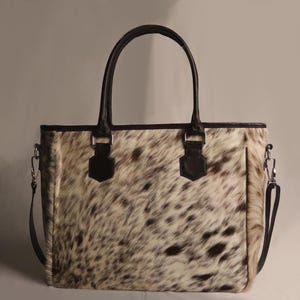 Spacious Large Cowhide Tote Bag with fringe! A Western Cowhide Purse perfect as a Cowhide Tote Shoulder Bag. Genuine Cowhide Leather Purse Bag, an ideal gift.