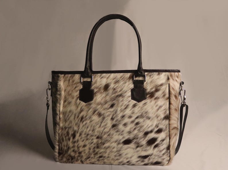 Spacious Large Cowhide Tote Bag with fringe! A Western Cowhide Purse perfect as a Cowhide Tote Shoulder Bag. Genuine Cowhide Leather Purse Bag, an ideal gift.