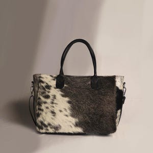 Spacious Large Cowhide Tote Bag with fringe! A Western Cowhide Purse perfect as a Cowhide Tote Shoulder Bag. Genuine Cowhide Leather Purse Bag, an ideal gift.