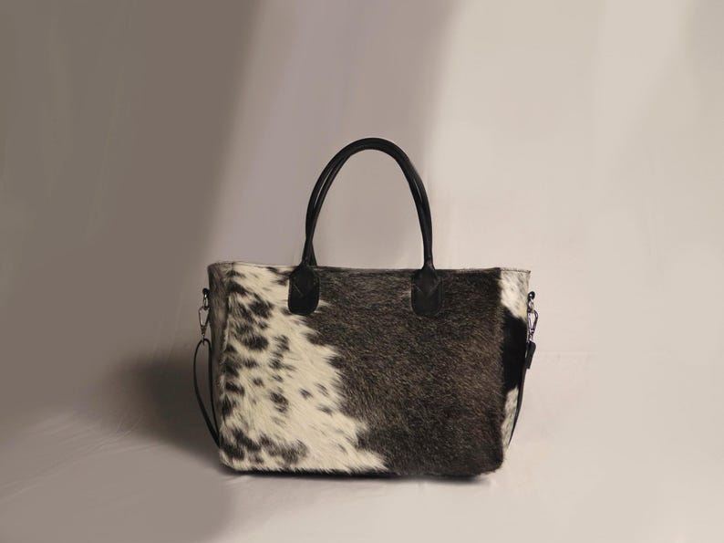 Spacious Large Cowhide Tote Bag with fringe! A Western Cowhide Purse perfect as a Cowhide Tote Shoulder Bag. Genuine Cowhide Leather Purse Bag, an ideal gift.