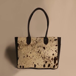 Spacious Large Cowhide Tote Bag with fringe! A Western Cowhide Purse perfect as a Cowhide Tote Shoulder Bag. Genuine Cowhide Leather Purse Bag, an ideal gift.