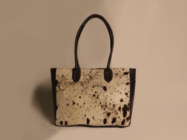 Spacious Large Cowhide Tote Bag with fringe! A Western Cowhide Purse perfect as a Cowhide Tote Shoulder Bag. Genuine Cowhide Leather Purse Bag, an ideal gift.