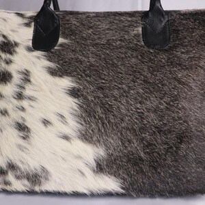 Spacious Large Cowhide Tote Bag with fringe! A Western Cowhide Purse perfect as a Cowhide Tote Shoulder Bag. Genuine Cowhide Leather Purse Bag, an ideal gift.