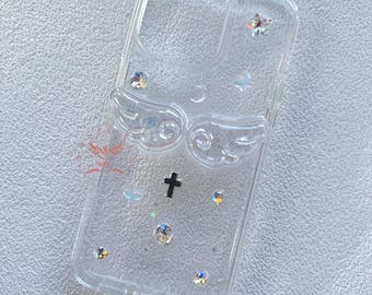 May include: Clear phone case with a silver angel wing design, a black cross, and iridescent glitter accents.