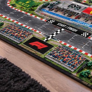 Race Car Road Rug and Kid Grand Prix Activity Carpet featuring a Formula 1 Track Play Mat for pretend racing adventures, a fun Nursery Educational Mat that encourages Imaginative Play for kids who love Red Bull Mercedes Ferrari racing cars.