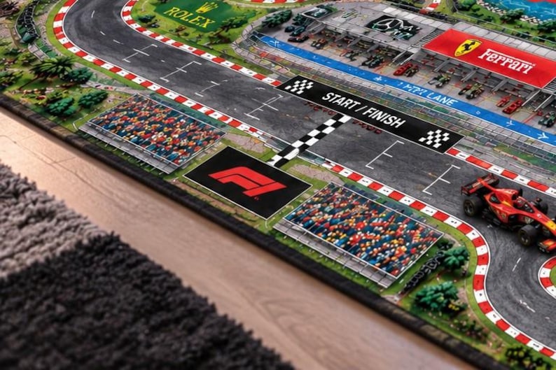 Race Car Road Rug and Kid Grand Prix Activity Carpet featuring a Formula 1 Track Play Mat for pretend racing adventures, a fun Nursery Educational Mat that encourages Imaginative Play for kids who love Red Bull Mercedes Ferrari racing cars.