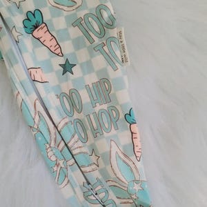 Charming Baby Boy Easter Bunny Sleepers crafted from soft, comfortable material for infants and toddlers. Perfect Soft Infant Spring Pajamas for Newborns Toddlers and Holiday Photos, creating the cutest Cute Bunny Outfit Ideas for Easter festivities.