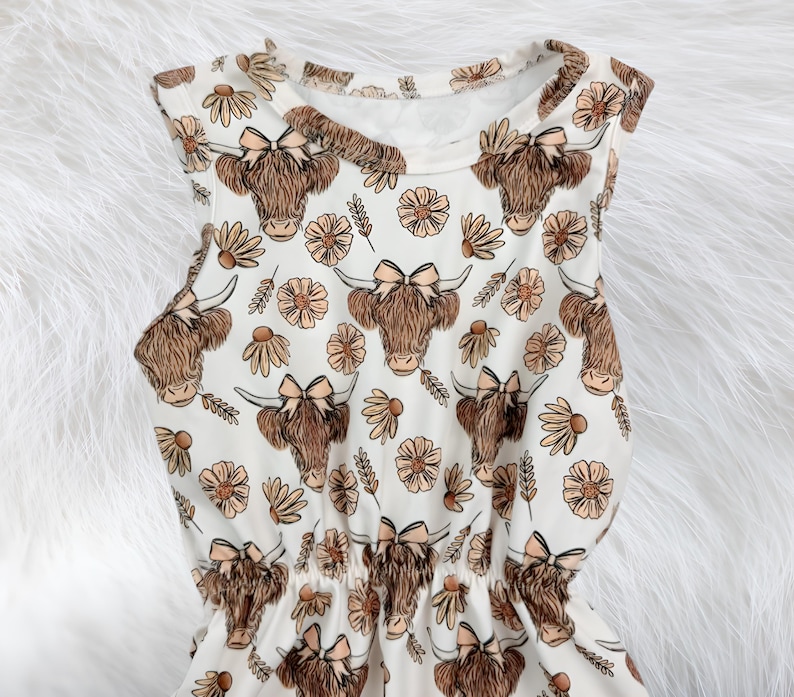 Baby cowgirl summer outfit with floral highland cow print romper designed for comfort and style. This cute clothes for girls piece makes a thoughtful baby gift for girls and a sweet baby shower gift parents will love.