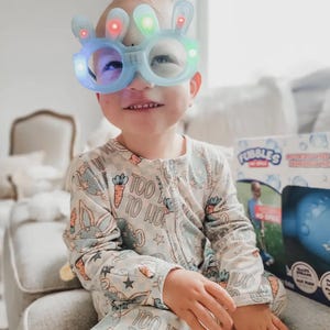 Cozy Baby Boy Easter Bunny Sleepers for newborns and toddlers, featuring sweet bunny details. These Soft Infant Spring Pajamas for Newborns Toddlers and Holiday Photos are ideal Cute Bunny Outfit Ideas for Easter parties and family photo sessions.
