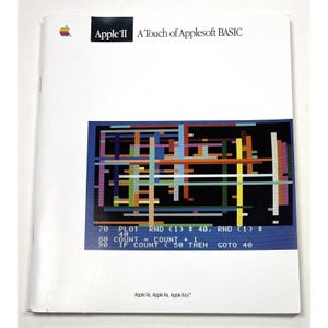 May include: A white manual titled "Apple II A Touch of Applesoft BASIC" with the Apple logo. The cover features a colorful geometric design and lines of code. The text "Apple II" is in a black rectangle.