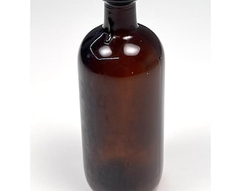 May include: A brown glass bottle with a rounded body and a narrow neck. The bottle has a dark brown color and a smooth surface. The opening of the bottle is a darker shade of brown. The bottle is empty and appears to be made of glass.