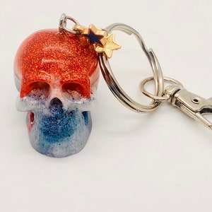 Handmade red, white, and blue resin skull keychain with matching star charms