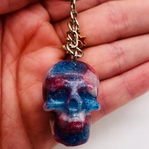 Handmade red, white, and blue resin skull keychain with matching star charms