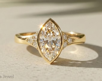 Anillo de compromiso con diamante marquesa de laboratorio, engaste de bisel de oro amarillo de 18 quilates