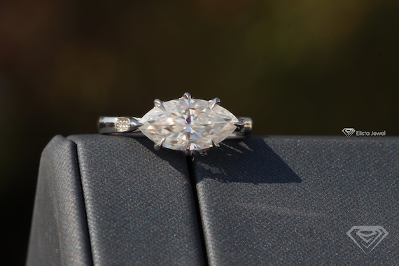 East west shop marquise setting