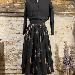 1950s black, orange, and pink dandelion novelty print circle skirt