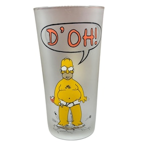 May include: Frosted glass tumbler featuring Homer Simpson with the phrase "D'OH!" in a speech bubble. Homer is depicted in his underwear, holding a donut. The design is in yellow, orange, and black.