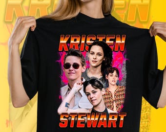 May include: Black t-shirt with a retro-style graphic of Kristen Stewart, featuring the text "KRISTEN STEWART". The design includes multiple images of the actress. The t-shirt has a crew neck and is made of a soft material.