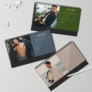 May include: Three spiral-bound desk calendars with photos for January, February, and March. The January calendar has a green background, the February calendar has a blue background, and the March calendar has a tan background. Each calendar displays the month and days.