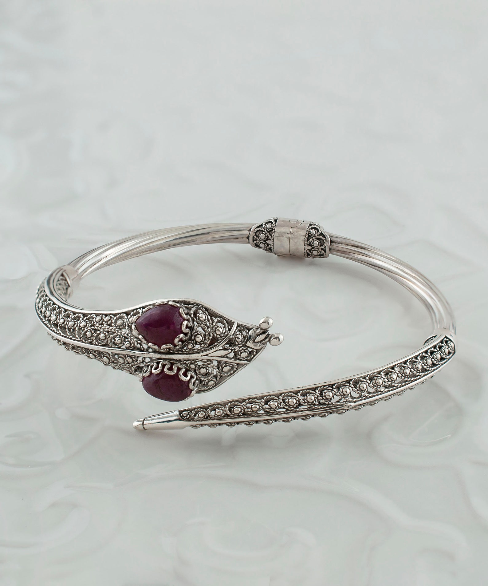 Ruby corundum serpent cuff bracelet with coiled silver filigree and dual gemstone setting