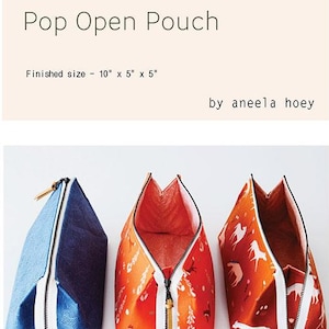 May include: Three pop-open pouches with white zippers, one blue, and two orange with a horse and floral pattern. Finished size is 10" x 5" x 5". Accessories include scissors, pins, and a tape measure. The text "Pop Open Pouch" is at the top.