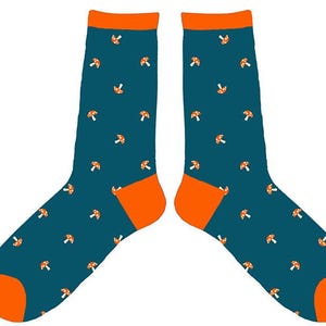 May include: A pair of teal blue socks with an orange cuff and a repeating pattern of orange mushrooms.