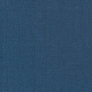 May include: A close-up of a solid, textured fabric in a deep blue color. The fabric has a subtle woven pattern, creating a slightly rough surface. The color is consistent throughout the image.