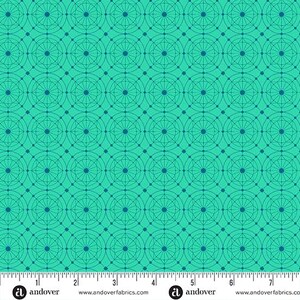 May include: A teal fabric with a repeating geometric pattern of circles and lines. The design features concentric circles connected by straight lines, creating a grid-like structure. The fabric has a ruler along the bottom edge.