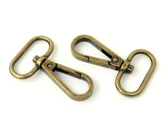 Sallie Tomato - Ganchos giratorios de 2,5 cm (oro antiguo) (2 unidades)