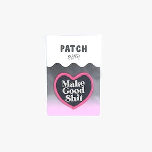 May include: A pink heart-shaped patch with the text "Make Good Shit" in white lettering on a black background. The patch is labeled "Patch by Katm."