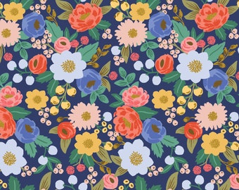 May include: A repeating floral pattern on a navy blue background. The design includes flowers in shades of pink, orange, yellow, and blue, with green leaves and small white berries. A vibrant and colourful design.
