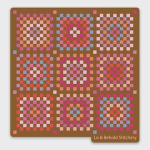 May include: A brown square coaster featuring a colorful pixelated design of nine squares. Each square has a different pattern of pink, orange, blue, and purple squares. The text "Lo & Behold Stitchery" is in the bottom right corner.