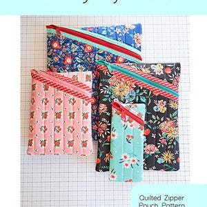 May include: Four quilted zipper pouches in various sizes, each with a different floral or fruit pattern. The pouches have a diagonal zipper and are labeled "Hemingway Pouch". The image also includes the text "Quilted Zipper Pouch Pattern in Four Sizes".