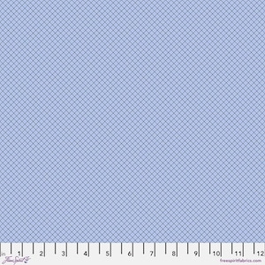 May include: Light blue fabric with a grid pattern. The fabric has a ruler along the bottom edge, with measurements in inches. The words "Free Spirit" and "freespiritfabrics.com" are also visible.