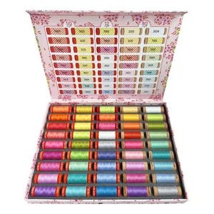 May include: A pink box filled with 50 spools of colorful thread. The box has a label with the numbers 50, 12, and 80. The spools are arranged in rows and columns.