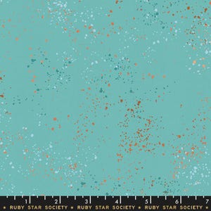 May include: A teal fabric with a speckled pattern. The pattern includes white, orange, and teal-colored speckles scattered across the surface. The text "RUBY STAR SOCIETY" is printed at the bottom.