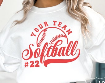 May include: White sweatshirt with red text that says "Your Team Softball #22" and a red baseball graphic.