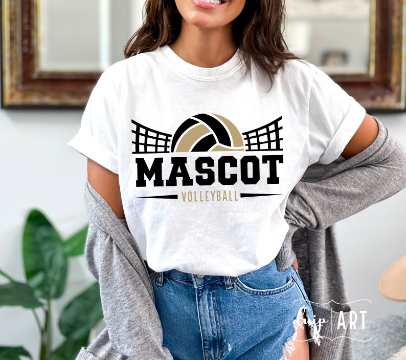 May include: White t-shirt with a black and gold volleyball graphic and the text "MASCOT VOLLEYBALL".