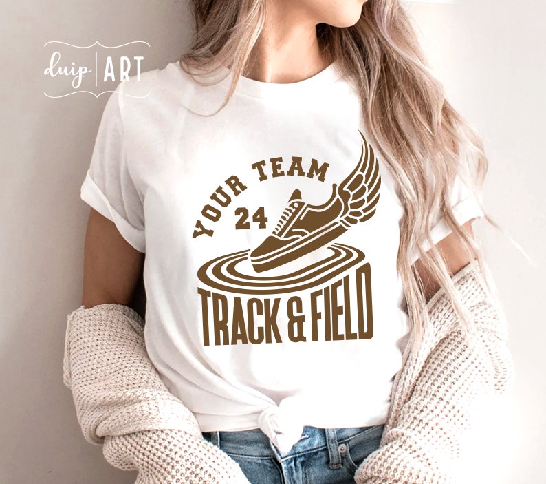 May include: White t-shirt with a brown graphic of a running shoe with wings and the text "Your Team 24 Track & Field"
