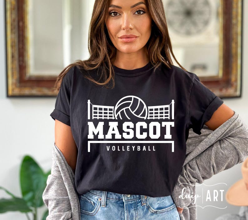 May include: Black t-shirt with a white volleyball graphic and the text "MASCOT VOLLEYBALL".