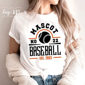 May include: White t-shirt with a black and orange baseball graphic. The graphic says "Mascot No. 22 Baseball Est. 20XX".