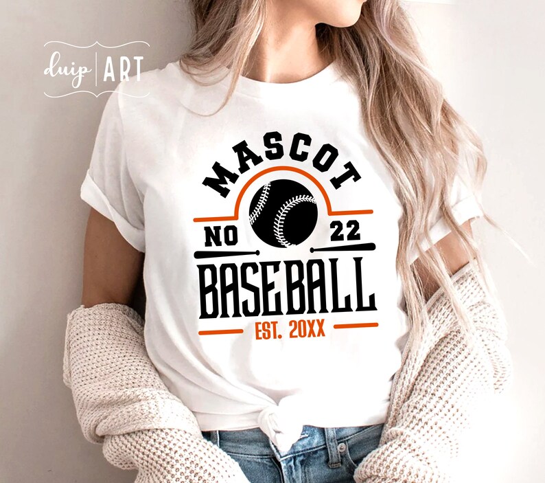 May include: White t-shirt with a black and orange baseball graphic. The graphic says "Mascot No. 22 Baseball Est. 20XX".