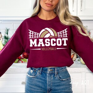 May include: Burgundy sweatshirt with a white volleyball graphic and the text "MASCOT VOLLEYBALL".