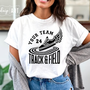 May include: White t-shirt with a black graphic design of a running shoe with wings and the text "Your Team 24 Track & Field".