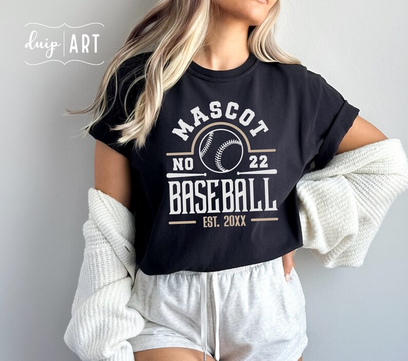 May include: Black t-shirt with a white graphic design that says "Mascot No. 22 Baseball Est. 20XX". The graphic includes a baseball and two crossed bats.