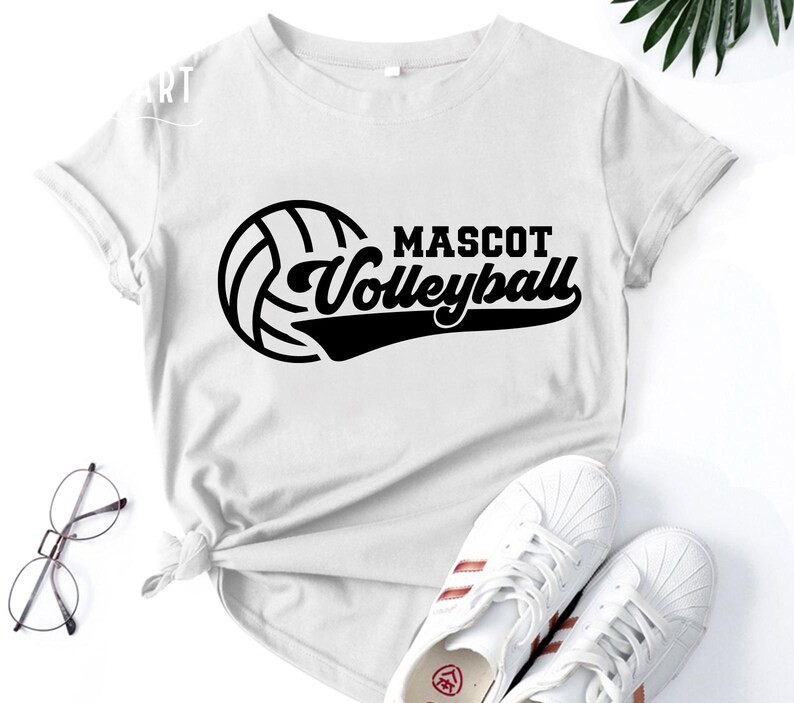 May include: White t-shirt with a black volleyball graphic and the text "Mascot Volleyball".