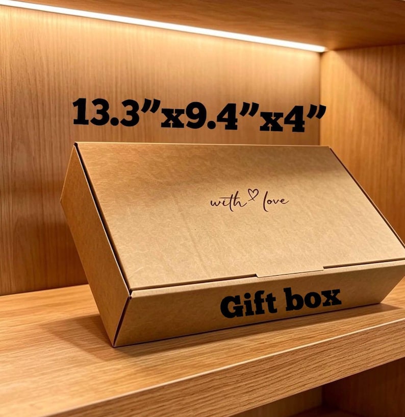 May include: A rectangular brown cardboard gift box with the text "with love" and a heart symbol printed on the lid, and the words "Gift box" on the front side. The box dimensions are clearly printed as 33.8 cm by 23.9 cm by 10.2 cm.