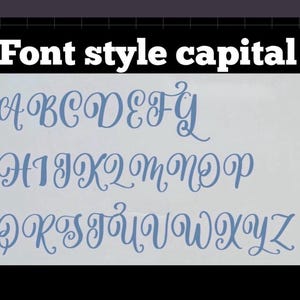May include: A white rectangular sheet displays the full alphabet in a blue cursive font style capital. The letters are arranged in three rows against a plain background. The text Font style capital is printed in white at the top of the image.